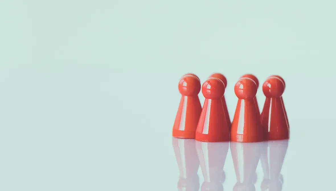 A group of small wooden game pieces grouped together