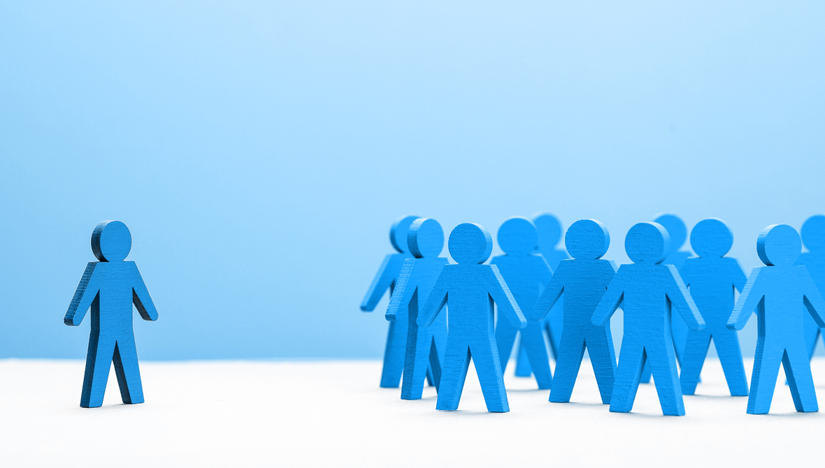 Illustration of a group of human figures all standing together and one figure standing separately off to the side