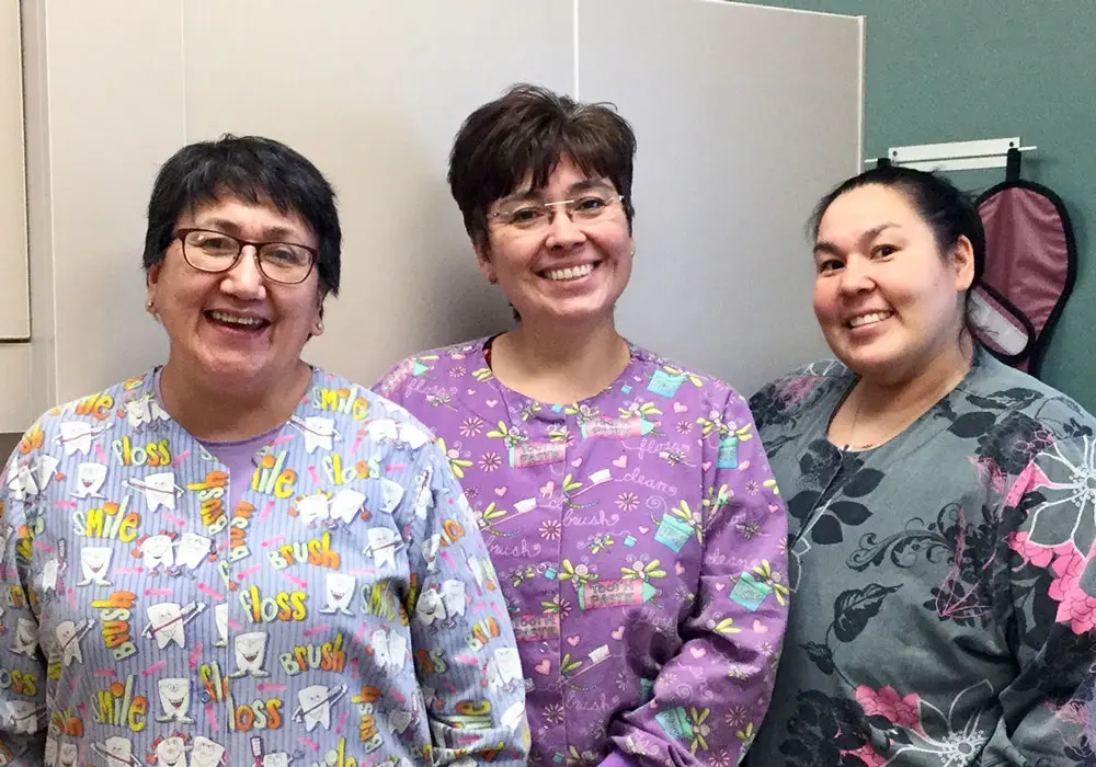 Photo of Aurora Johnson (representing changemakers in rural communities) with dental assistants Deborah Ivanoff and Jerilyn Alakayak.