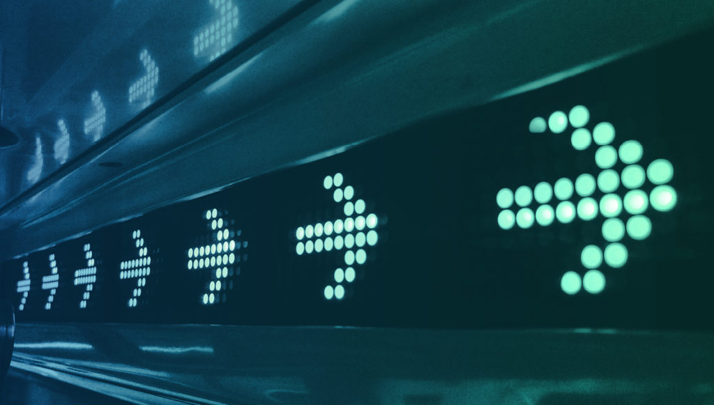 Photo of a digital sign showing arrows pointing forward