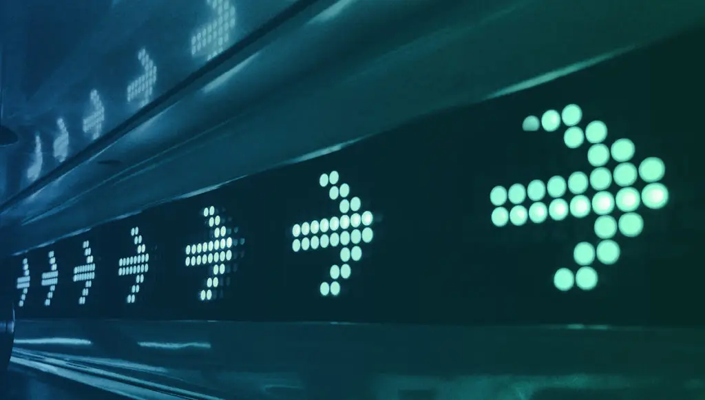 Photo of a digital sign showing arrows pointing forward