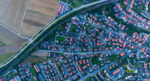 Aerial photograph of a suburban neighborhood sharing a border with rural farmland
