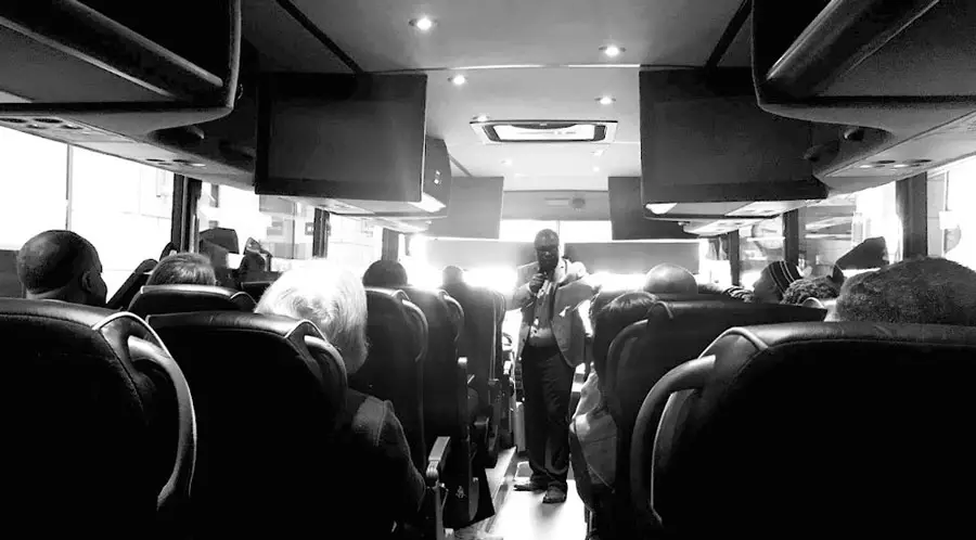 Photo of board members on a bus
