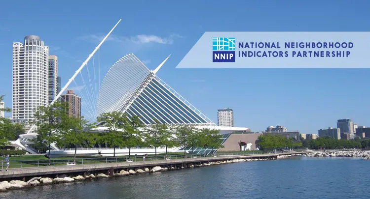 Photo of the city skyline of Milwaukee, with an overlay of the National Neighborhood Indicators Parternship logo logo