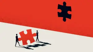 Illustration of two people carrying a large puzzle piece toward a wall with a puzzle piece missing