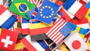 Photo of a pile of tiny, paper, international flags