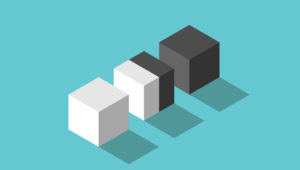 Illustration of a white cube, a black cube, and a cube in the middle that is half white and half black