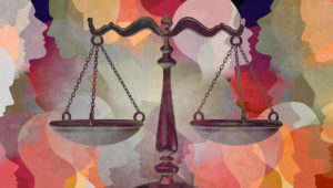 Illustration of the scales of justice shown over a background of silhouettes of human faces in different colors