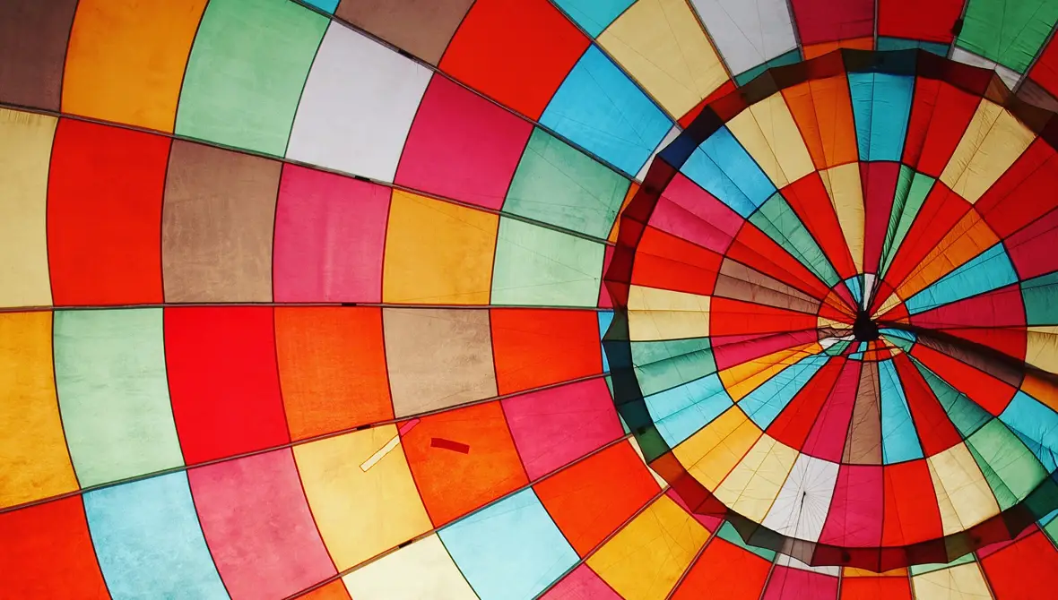 Photo of the inside of a mulit-colored hot air balloon