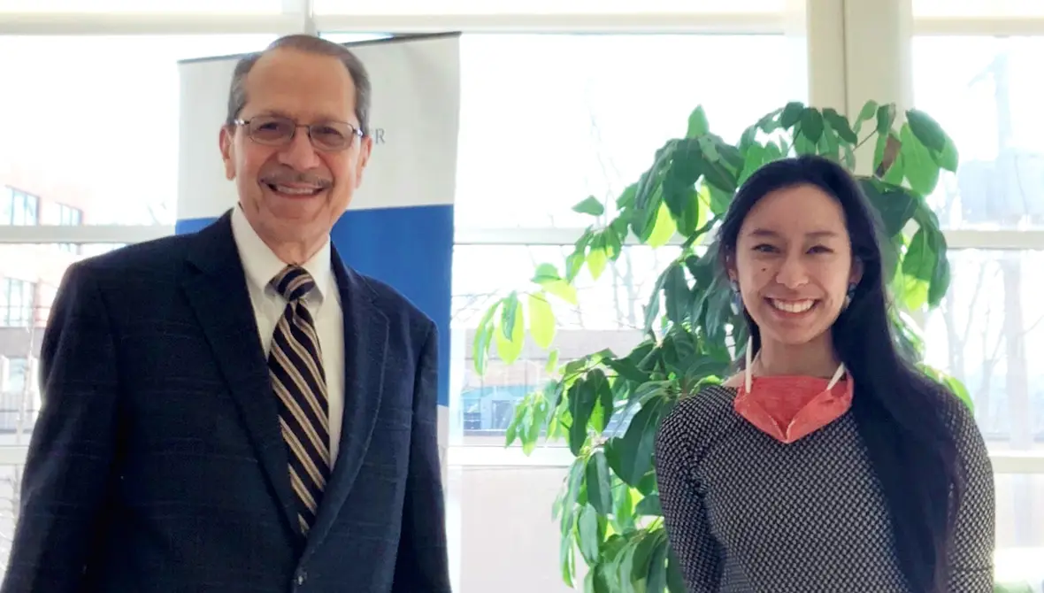 Photo of Juan Olivarez and Trish Abalo standing in the lobby of the Johnson Center