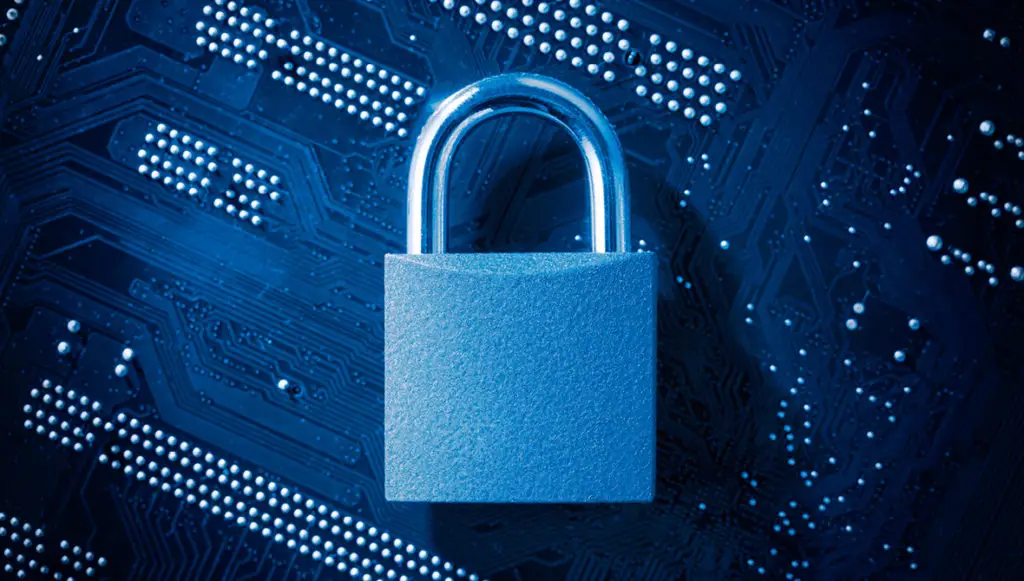 Photo of a padlock on computer motherboard, symbolizing cybersecurity