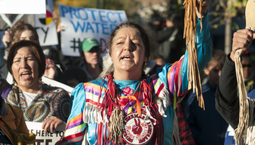 Photo of an Indigenous woman chanting slogans during a solidarity rally with the Dakota Access Pipeline protesters on November 5, 2016 in Toronto, Canada (representing Native American communities)
