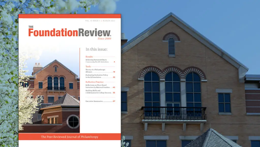 Front cover of The Foundation Review Volume 15, Issue 1, featuring a photo of a brick building on the GVSU Pew Campus in Downtown Grand Rapids, Mich.