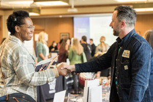 Attendees shake hands at the Nonprofit Board Connect event in Grand Rapids, Mich.