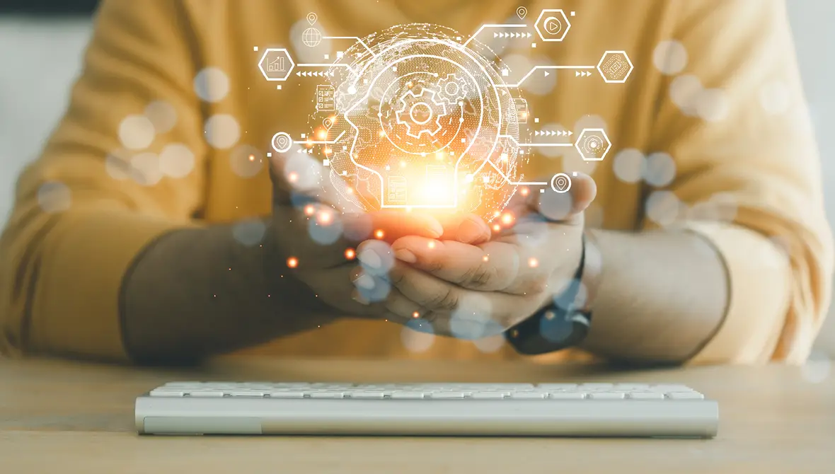 Close-up of a Black woman's hands cupped, holding a glowing light with artificial intelligence imagery superimposed on the photo