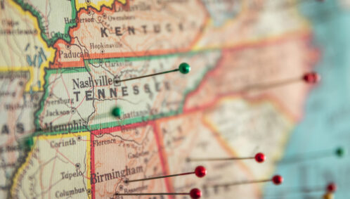 A close-up of a U.S. map shows several southern states with the camera focus on Kentucky, Tennessee, Alabama, Mississippi, and Georgia