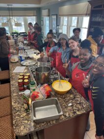 Student volunteers prepare cookies for members of Gilda's Club GR.